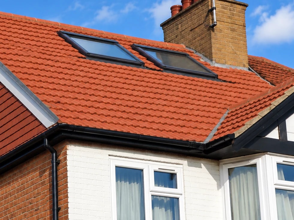 Two roof windows set into an existing pitched roof