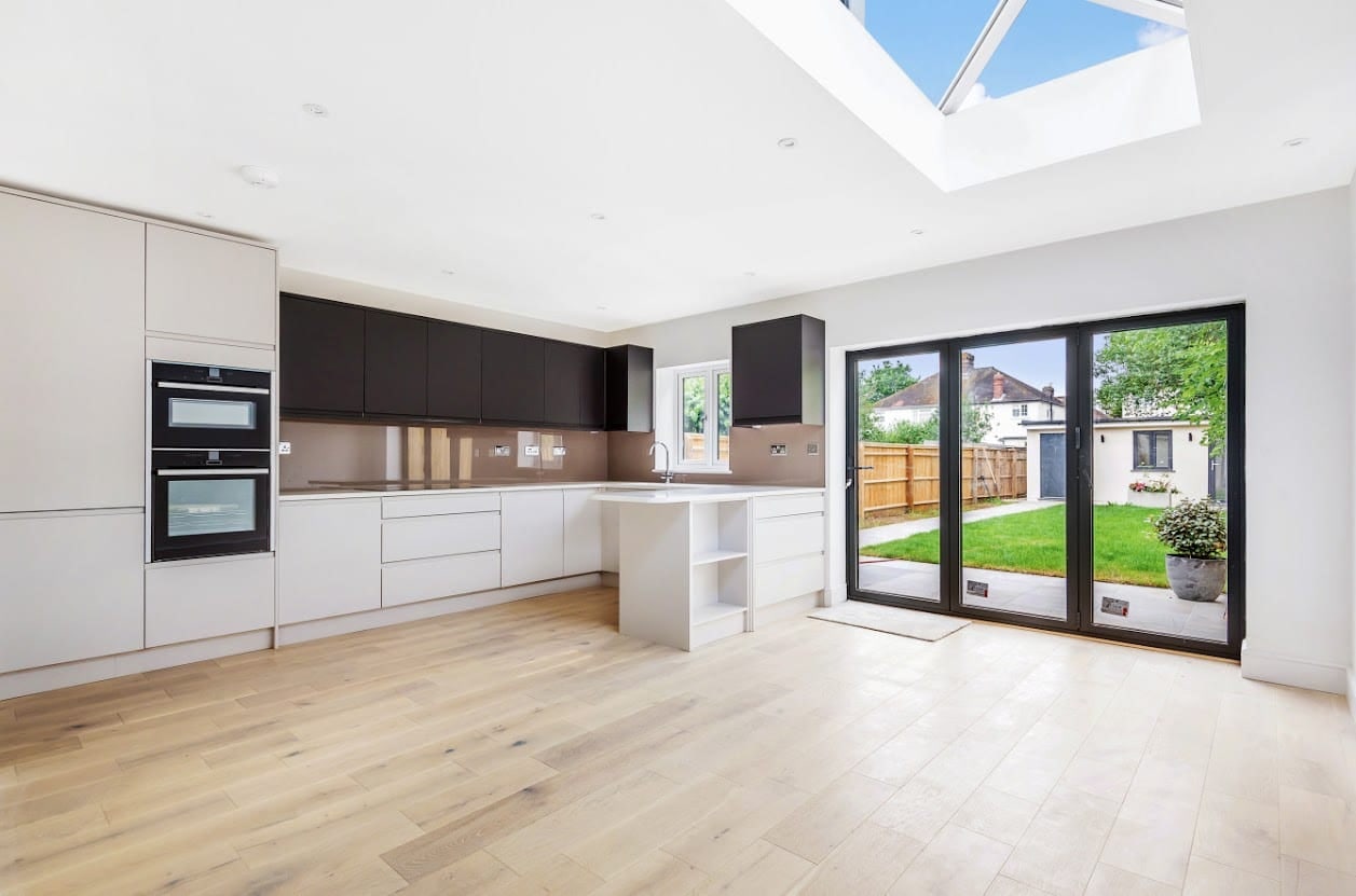 Kitchen extension with a roof lantern and bifold doors opening to the garden in Oxford