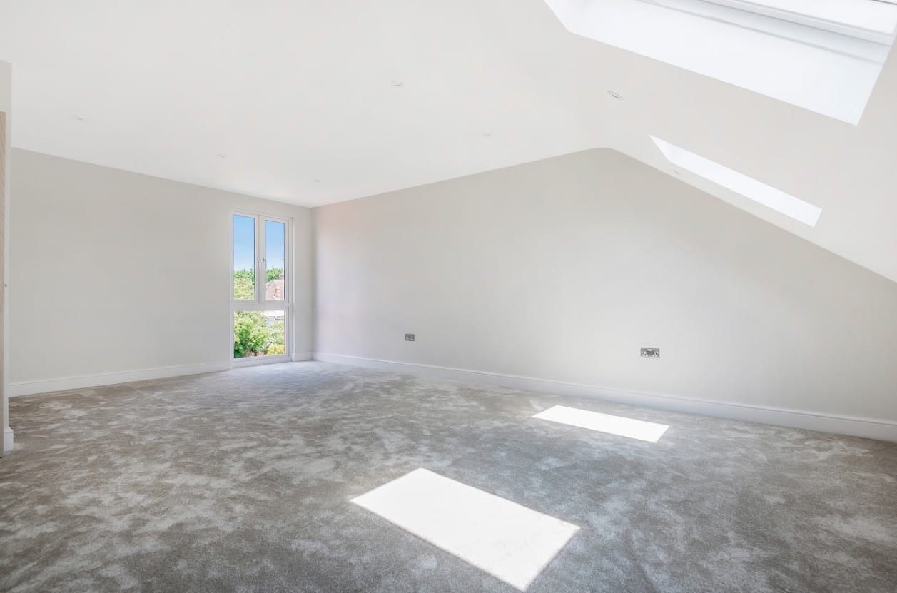 Completed loft room with a rooflight and gable window in Oxford