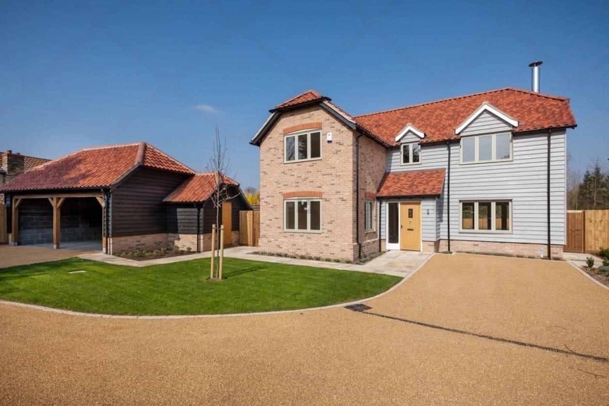 Newly completed brick home with dormer windows in Oxfordshire