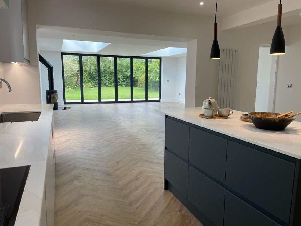 Open-plan kitchen extension with skylights and garden views in Oxford