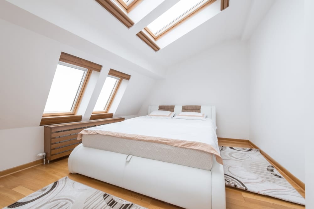 Bedroom in a Velux loft conversion with rooflights and eaves storage